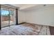 Bedroom with sliding glass door and a decorative rug at 1240 S Idalia St, Aurora, CO 80017