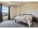 Bright bedroom with neutral carpet and a large window for natural light at 1240 S Idalia St, Aurora, CO 80017