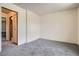 Empty bedroom features neutral colored carpet and white walls at 1240 S Idalia St, Aurora, CO 80017