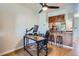 Inviting dining area open to kitchen with warm wood accents, perfect for casual dining and entertaining at 1240 S Idalia St, Aurora, CO 80017
