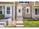Inviting entrance with stone facade and well-manicured lawn, perfect curb appeal at 1240 S Idalia St, Aurora, CO 80017