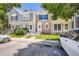 Charming townhome showcasing stone facade, well-maintained lawn, and convenient street parking at 1240 S Idalia St, Aurora, CO 80017