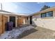 Well-maintained backyard featuring gravel, a wooden fence, and a wooden pergola at 1360 Wolff St, Denver, CO 80204