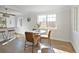 Bright dining area with hardwood floors and modern furniture, perfect for Gathering dinners and entertaining guests at 1360 Wolff St, Denver, CO 80204