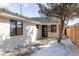 Charming single-story home featuring a light brick exterior, new roof, and modern front door at 1360 Wolff St, Denver, CO 80204