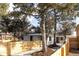 Beautiful one-story home boasts a newly installed fence, fresh landscaping, and a well-maintained exterior at 1360 Wolff St, Denver, CO 80204