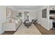 Bright living room featuring hardwood floors, a modern sofa, stylish decor, and an abundance of natural light at 1360 Wolff St, Denver, CO 80204