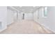 Large open basement area showcasing ample space and neutral carpet at 6500 W 32Nd Ave, Wheat Ridge, CO 80033