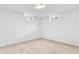 Finished basement with carpet, small window, and white walls at 6500 W 32Nd Ave, Wheat Ridge, CO 80033