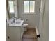 Stylish bathroom with quartz countertops, white vanity, and gold fixtures at 6500 W 32Nd Ave, Wheat Ridge, CO 80033