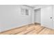 Cozy bedroom featuring hardwood floors, a closet, and a window with natural light at 6500 W 32Nd Ave, Wheat Ridge, CO 80033