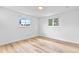 Cozy bedroom featuring hardwood floors and dual windows with natural light at 6500 W 32Nd Ave, Wheat Ridge, CO 80033