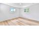 Bright bedroom featuring hardwood floors and dual windows with natural light at 6500 W 32Nd Ave, Wheat Ridge, CO 80033
