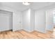 Cozy bedroom with hardwood floors, a closet, and access to a bathroom at 6500 W 32Nd Ave, Wheat Ridge, CO 80033