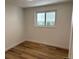 Bedroom with wood floors, a window and white walls at 6500 W 32Nd Ave, Wheat Ridge, CO 80033