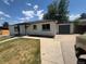 Charming single-story home with a lawn and driveway at 6500 W 32Nd Ave, Wheat Ridge, CO 80033
