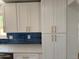 Modern kitchen with white cabinets and subway tile backsplash at 6500 W 32Nd Ave, Wheat Ridge, CO 80033