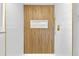 Modern shower with gold hardware, slatted feature wall, and white subway tile at 6500 W 32Nd Ave, Wheat Ridge, CO 80033