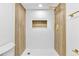 Updated shower showcasing glass enclosure and modern fixtures at 6500 W 32Nd Ave, Wheat Ridge, CO 80033