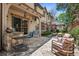 Charming back patio with stone flooring and comfortable seating, perfect for outdoor entertaining at 2891 E Alameda Ave, Denver, CO 80209