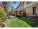 Spacious backyard featuring a lush green lawn and a cozy seating area, great for relaxing outdoors at 2891 E Alameda Ave, Denver, CO 80209