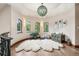 Bright bonus room featuring a rounded ceiling with unique architectural features, as well as unique decor at 2891 E Alameda Ave, Denver, CO 80209