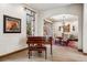 Open-concept with view of the dining room and piano at 2891 E Alameda Ave, Denver, CO 80209