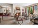 Inviting living room features a fireplace, French doors and neutral decor at 2891 E Alameda Ave, Denver, CO 80209