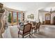 Spacious living room with french doors, stylish chairs and decorative details at 2891 E Alameda Ave, Denver, CO 80209