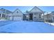 Two-story craftsman style home with a covered porch and attached two-car garage at 3904 Treadway Pt, Castle Rock, CO 80108