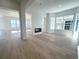 Spacious living room with hardwood floors and a built-in fireplace at 3904 Treadway Pt, Castle Rock, CO 80108