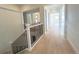 Modern staircase with black metal balusters and light hardwood flooring at 3904 Treadway Pt, Castle Rock, CO 80108