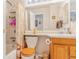 Cozy full bathroom featuring a shower/tub combo and an oak vanity at 42 S Moline St, Aurora, CO 80012