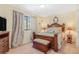Comfortable bedroom featuring a wooden bed frame, matching furniture, and soft natural lighting at 42 S Moline St, Aurora, CO 80012