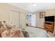 Bedroom showcasing closet, dresser and a well-lit interior, complemented by plush bedding at 42 S Moline St, Aurora, CO 80012