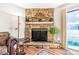 Stone fireplace with a mantel and decorative items, creating a cozy focal point in the living room at 42 S Moline St, Aurora, CO 80012