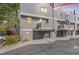 A row of townhome garages at sunset, with the unit number 62 over the center one at 42 S Moline St, Aurora, CO 80012