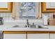 Close-up of the kitchen sink area with a stainless steel faucet and sink basin at 42 S Moline St, Aurora, CO 80012