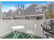 Outdoor patio with a table and chairs, and a grill at 42 S Moline St, Aurora, CO 80012