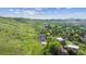 Aerial view of the home nestled on green hillside at 2605 Cactus Cir, Golden, CO 80401