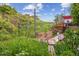 Picturesque backyard features a garden and lush greenery, creating a tranquil outdoor retreat at 2605 Cactus Cir, Golden, CO 80401