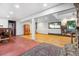 Spacious finished basement with a rustic stone accent and ample room for various activities at 2605 Cactus Cir, Golden, CO 80401