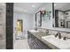Elegant bathroom with a double sink vanity, granite countertops, and decorative tile accents at 2605 Cactus Cir, Golden, CO 80401