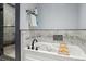 A luxurious soaking tub sits beside a frameless shower in this well appointed bathroom at 2605 Cactus Cir, Golden, CO 80401