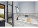 A luxurious soaking tub sits beside a frameless shower in this well appointed bathroom at 2605 Cactus Cir, Golden, CO 80401
