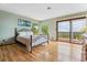 Bright bedroom with hardwood floors, balcony and view at 2605 Cactus Cir, Golden, CO 80401