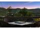 Outdoor patio with table and chairs, perfect for enjoying the stunning mountain scenery at 2605 Cactus Cir, Golden, CO 80401