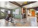 Basement area with exercise equipment, flagstone tile floors, and stone details at 2605 Cactus Cir, Golden, CO 80401