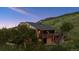 Hillside home featuring a spacious deck and stunning natural surroundings at 2605 Cactus Cir, Golden, CO 80401
