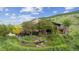 Charming hillside home with mature trees, terraced gardens, and inviting deck at 2605 Cactus Cir, Golden, CO 80401